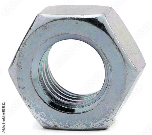 Close-up of galvanized steel nut on white background photo