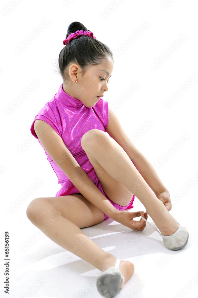 latin cute little girl in dancing practice putting ballet shoe latin cute little girl in dancing practice putting ballet shoe