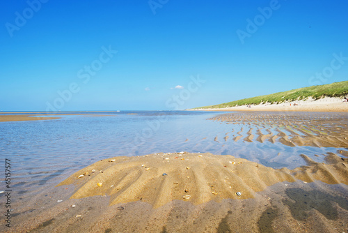 North Sea along a sunny beach in spring photo