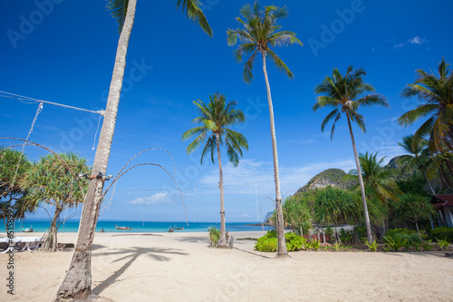 Tropical beach with palms © witthaya
