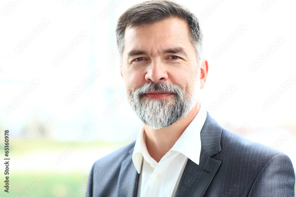Portrait of a happy senior business man smiling Portrait of a happy senior business man smiling