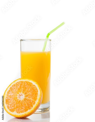 glass of orange juice and half orange with space for text