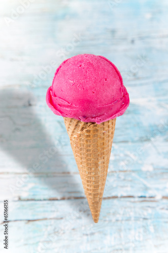 Ice cream scoops on wooden table.