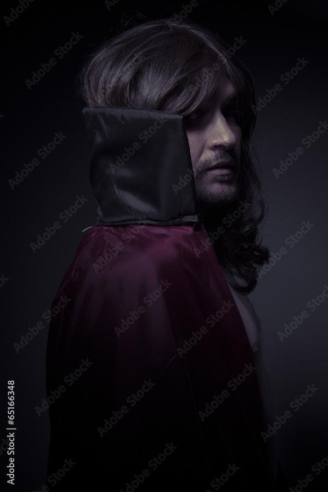 Devil man with long hair and black coat