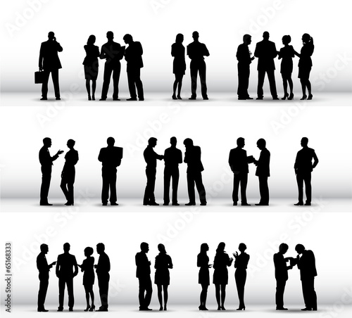 Silhouettes of Business People Working in a Row