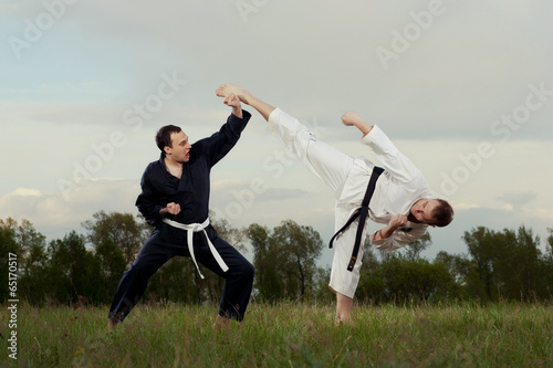 Karate fighters practice outdoor