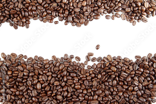 Roasted coffee beans on white background. Copy space