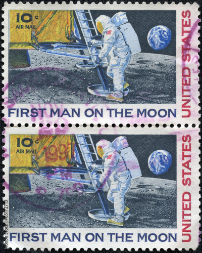 Obraz na płótnie stamp shows Neil Armstrong, first step on the moon w salonie