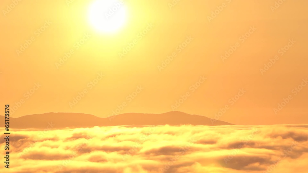 Time lapse of sunrise over fog-filled mountain valley. Time lapse of sunrise over fog-filled mountain valley.