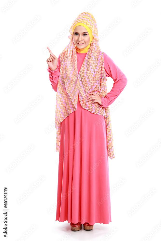 beautiful woman wearing pink muslim dress pointing