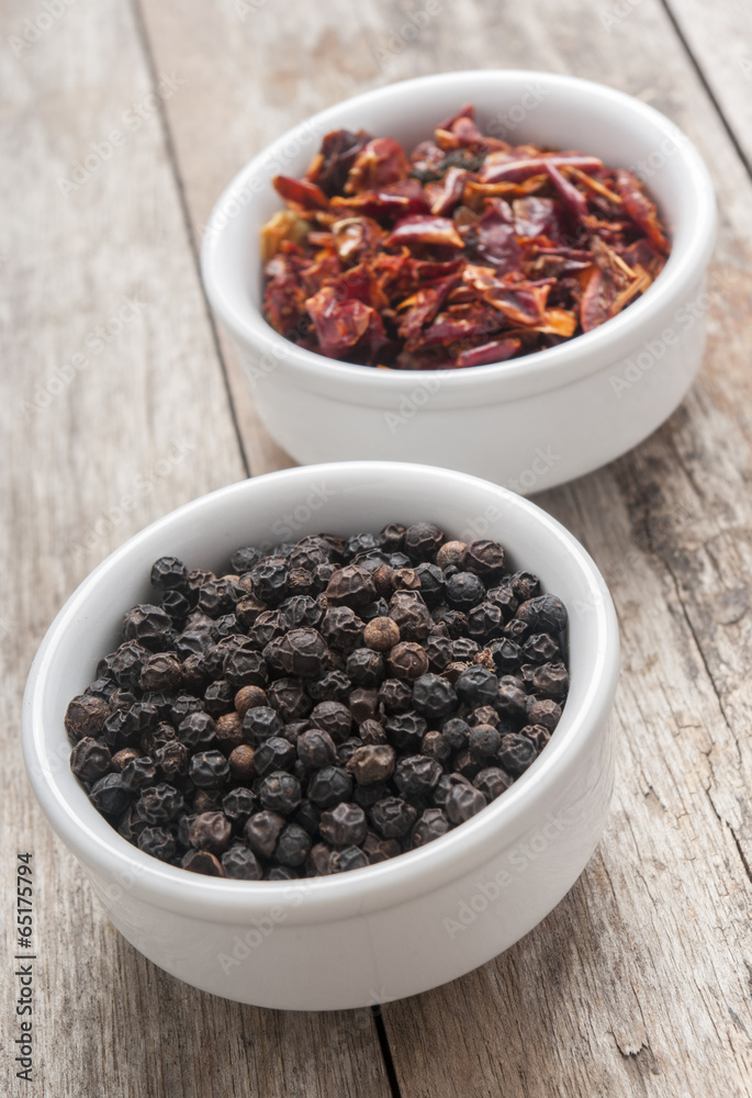 Black pepper on wood background close up Black pepper on wood background close up