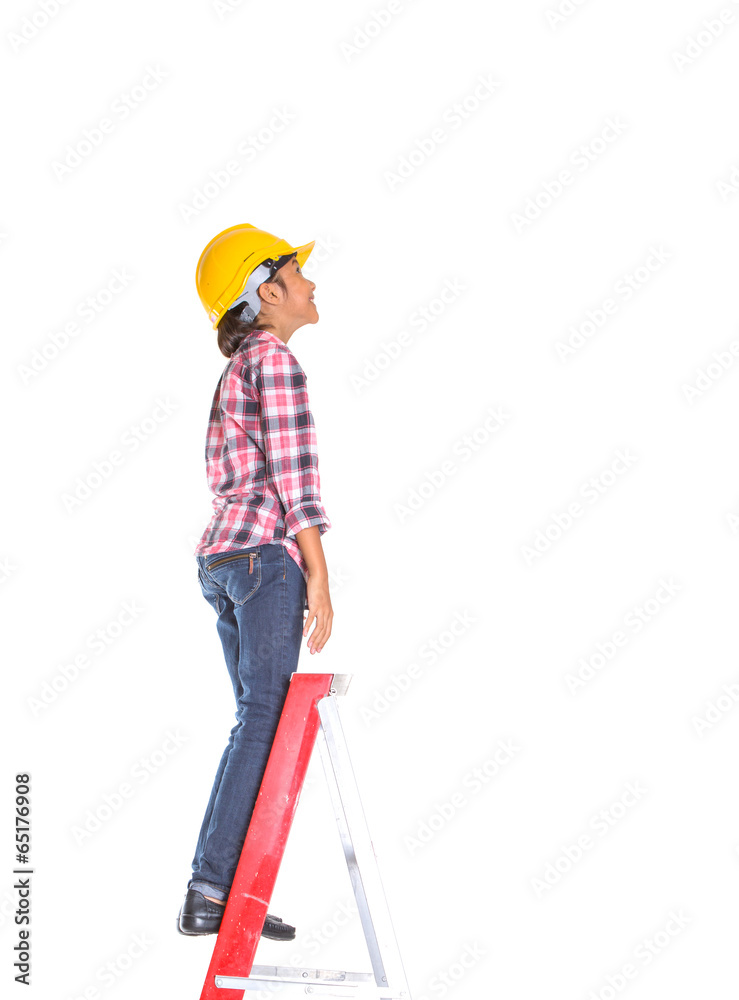 Young Asian Malay girl with hard hat on a ladder Young Asian Malay girl with hard hat on a ladder