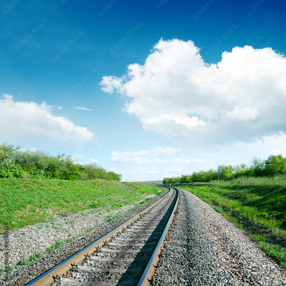 Fototapeta premium white clouds over railroad