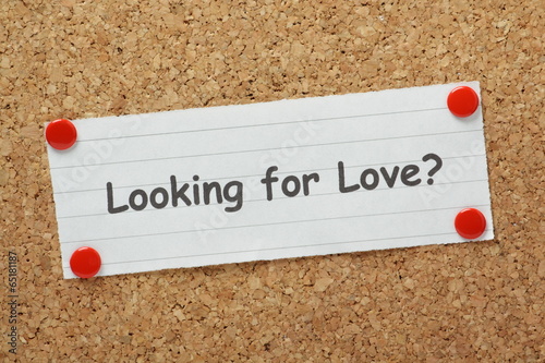 The phrase Looking For Love? on a cork notice board