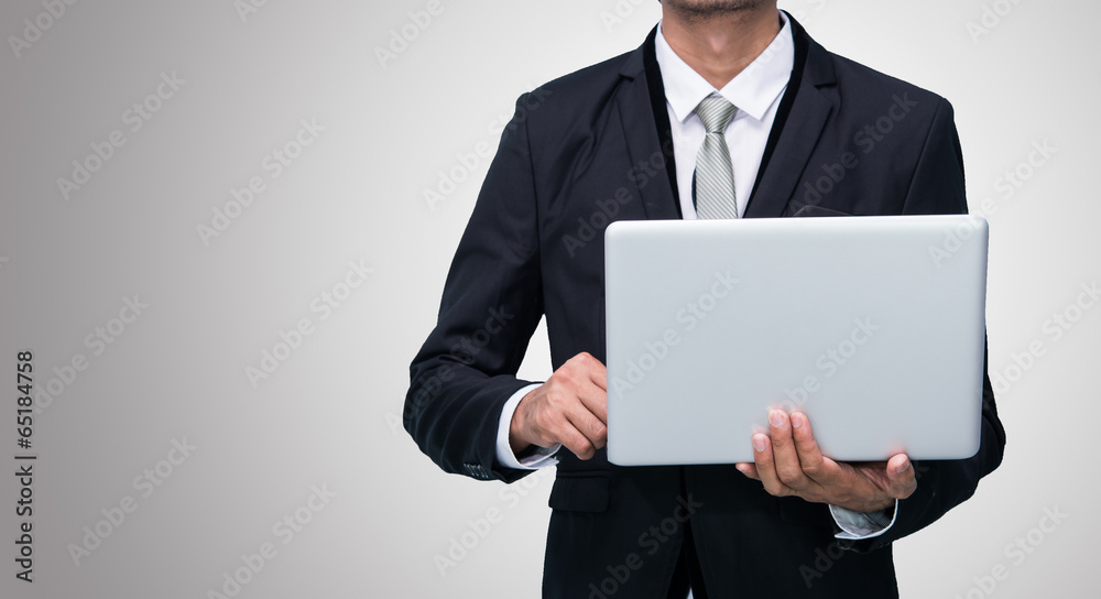 Businessman standing posture hand hold notebook laptop isolated