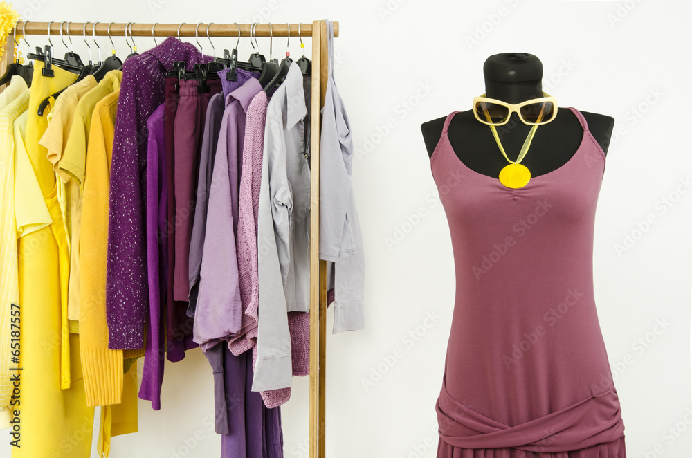 Mannequin with complementary colors violet and yellow clothes. Mannequin with complementary colors violet and yellow clothes.