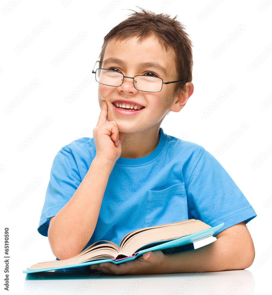 Little boy is reading a book Little boy is reading a book
