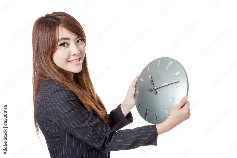 Asian Businesswoman hold a clock and smile Asian Businesswoman hold a clock and smile