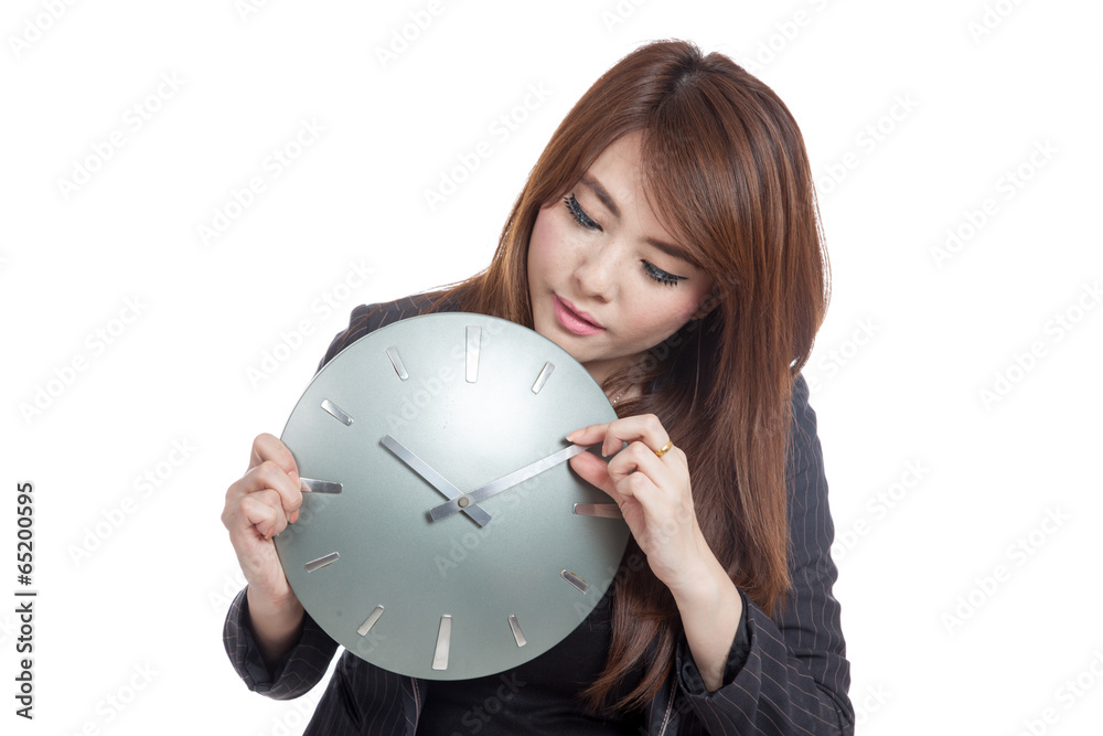 Asian Businesswoman move a clock hand Asian Businesswoman move a clock hand