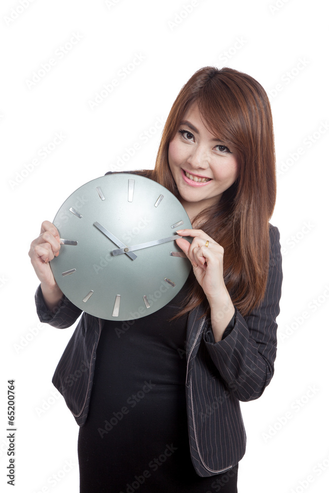 Asian Businesswoman move a clock hand and smile Asian Businesswoman move a clock hand and smile