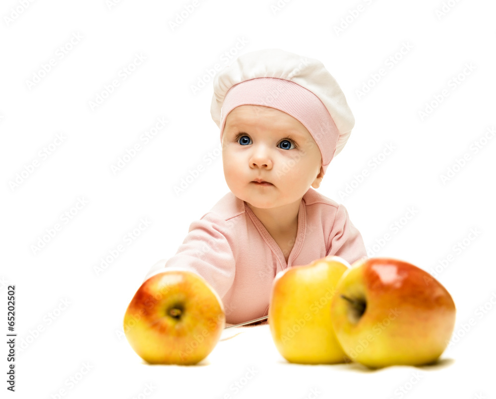 Little baby is looking into the camera and apple Little baby is looking into the camera and apple