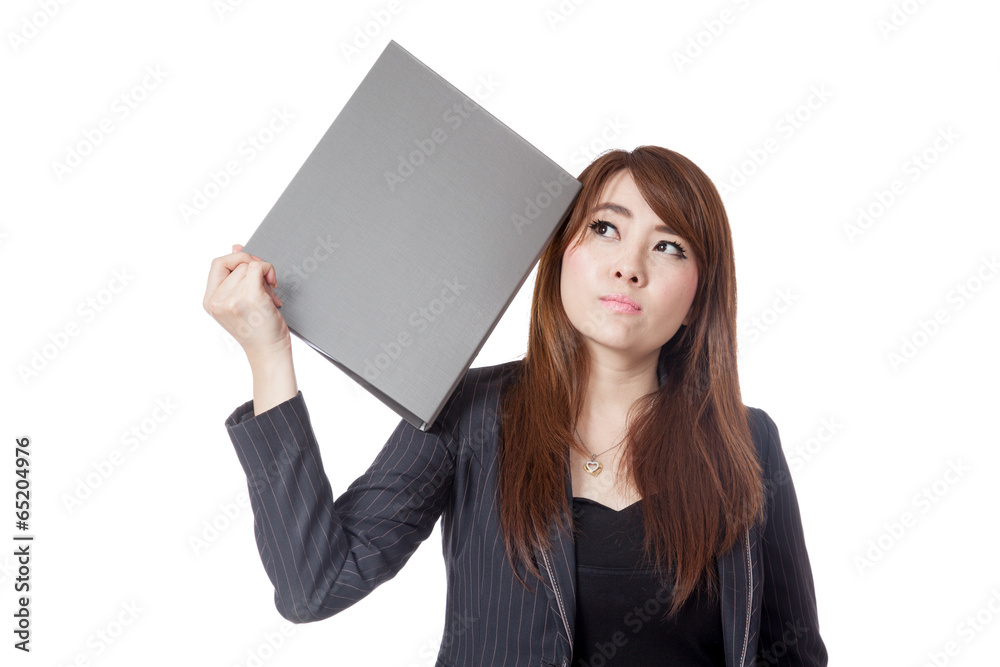 Asian Businesswoman forget something put a folder to her head Asian Businesswoman forget something put a folder to her head