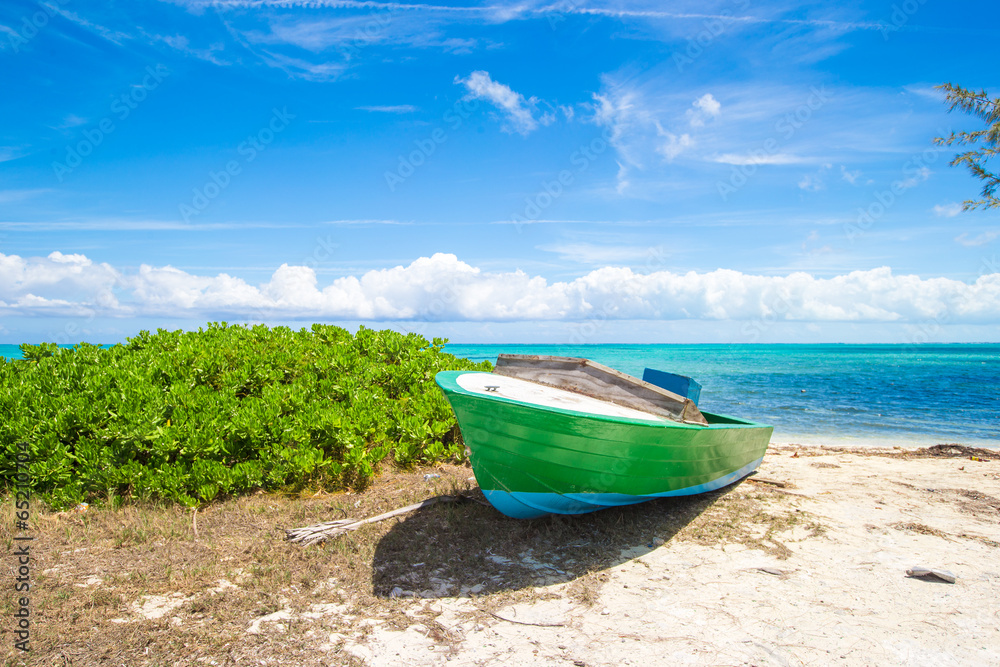 Old fishing boat on a tropical beach at the Caribbean Old fishing boat on a tropical beach at the Caribbean