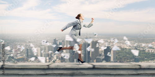 Running businesswoman © Sergey Nivens