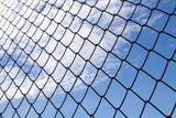 metallic net with blue sky background