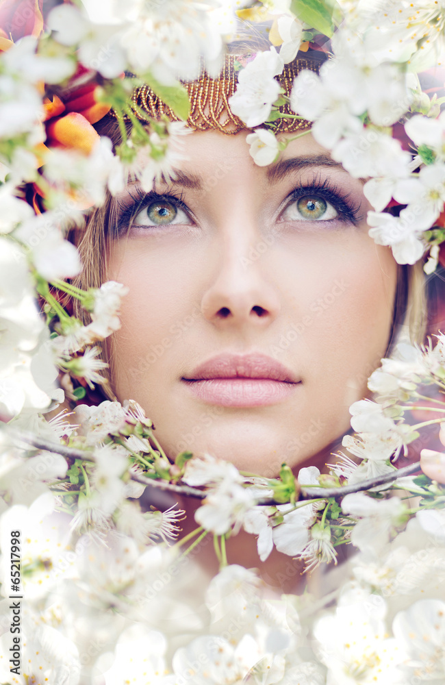 Pretty female face among the petals Pretty female face among the petals