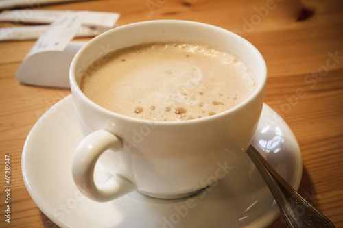 Cup of coffee on a wooden table