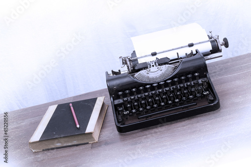 Vintage typewriter and old books