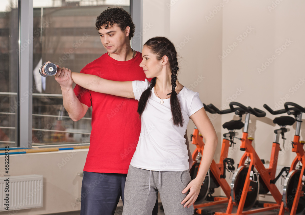 Fototapeta premium Trainer in the Gym