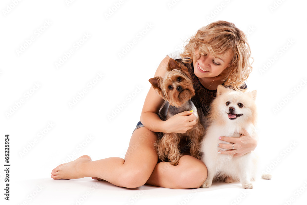 Cute young woman cuddling her dog Cute young woman cuddling her dog