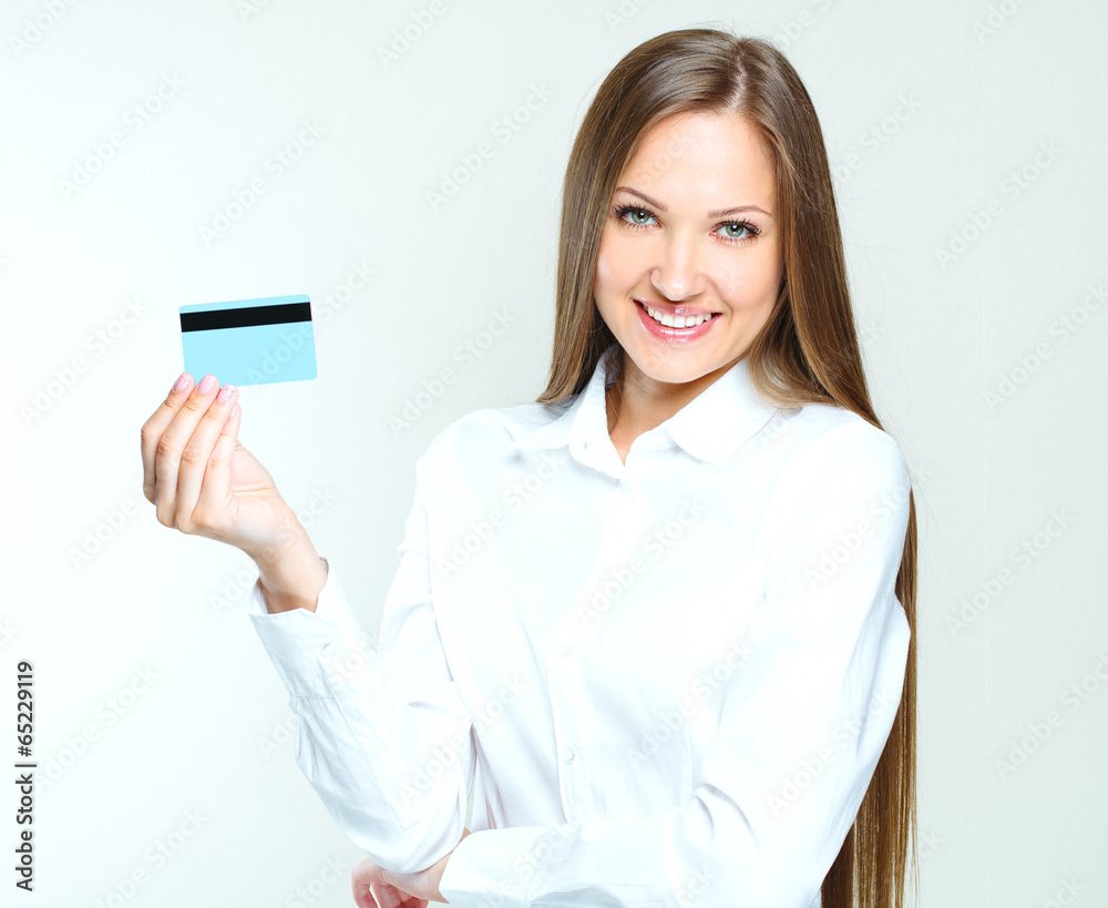 portrait of a smiling business woman holding blank credit card. portrait of a smiling business woman holding blank credit card.