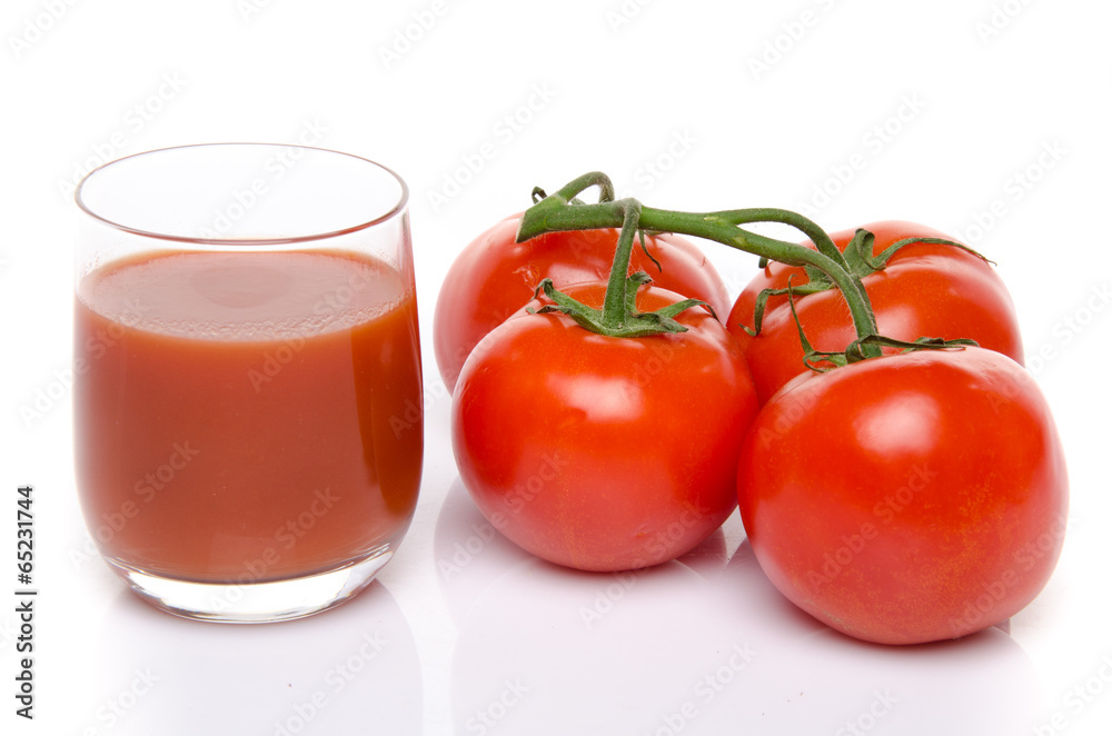 Glass of tomato juice with fresh tomatoes Glass of tomato juice with fresh tomatoes
