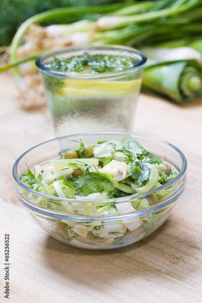 lemonade with parsley and bowl of vegetarian salad lemonade with parsley and bowl of vegetarian salad