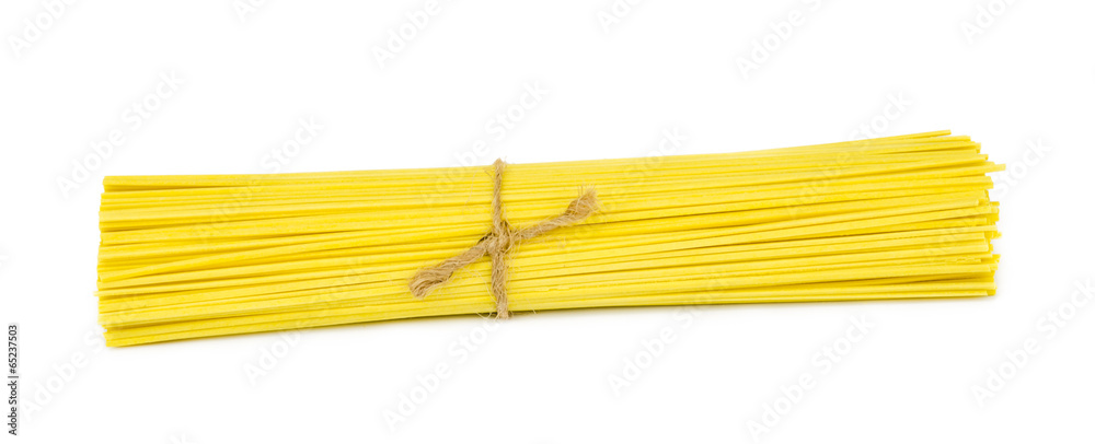 uncooked italian spaghetti . uncooked italian spaghetti .