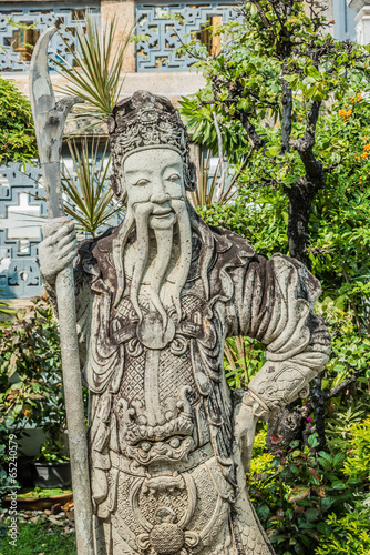 stone chinese guardian statue Wat Pho temple bangkok Thailand