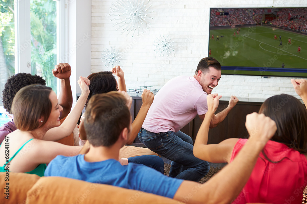 Fototapeta premium Group Of Friends Watching Soccer Celebrating Goal