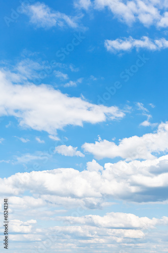 Canvas Print many white puffy clouds in blue sky