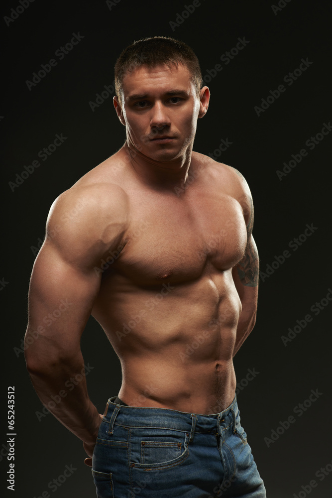 Muscle man posing in studio
