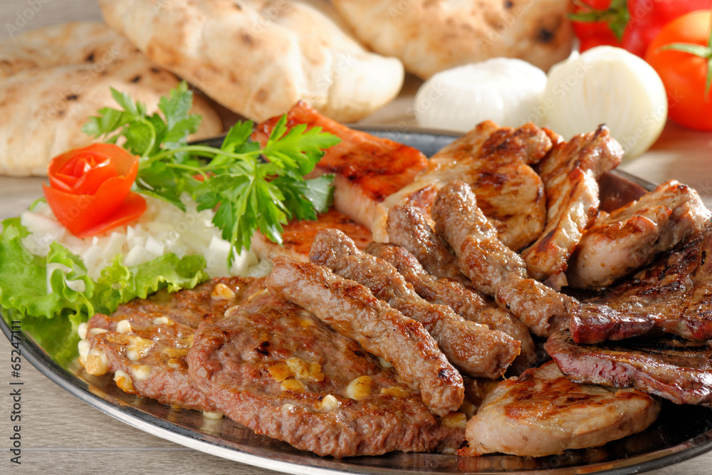 Wholesome platter of mixed meats including grilled steak