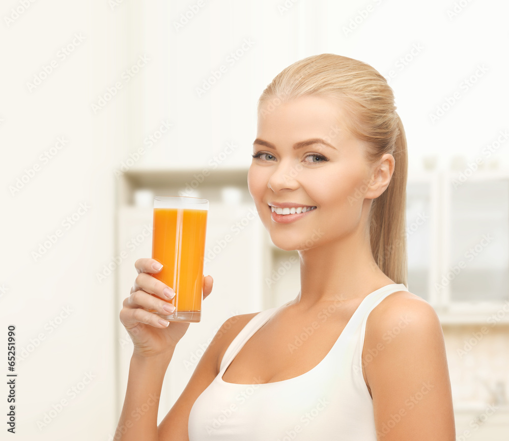 smiling woman holding glass of orange juice smiling woman holding glass of orange juice