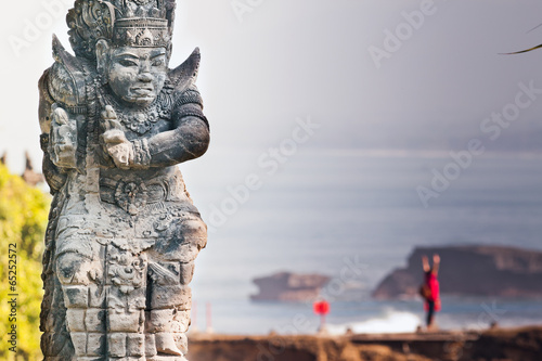 Balinese god on the background of the ocean. Indonesia, Bali