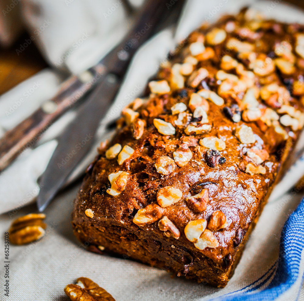 Homemade nut cake on wooden background