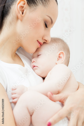 Mother hold little baby girl