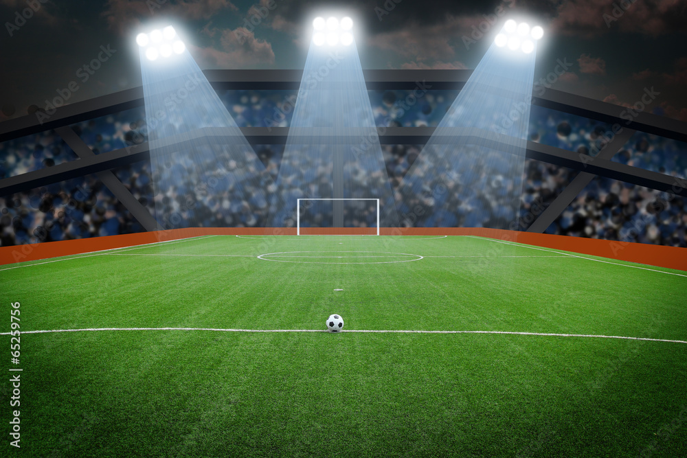 Obraz premium Piłka na boisku na stadionie w nocy
