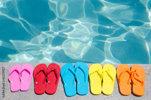 Color flip flops by the pool