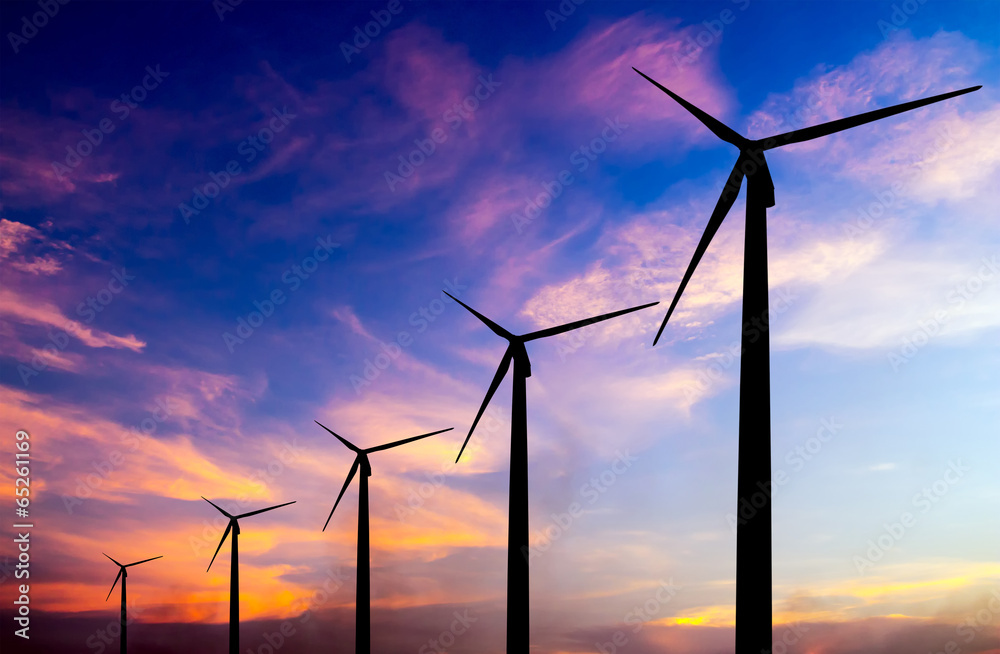 Fototapeta premium wind turbine silhouette on colorful sunset